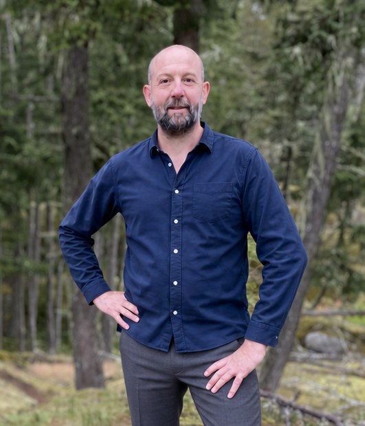 Bruce Winstone standing in the forest on Salt Spring Island